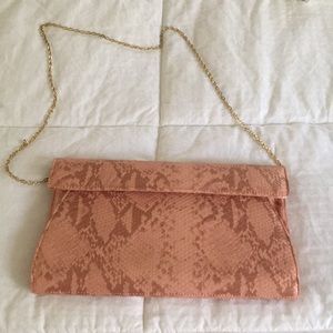 Coral faux snake skin clutch. Hardly worn.